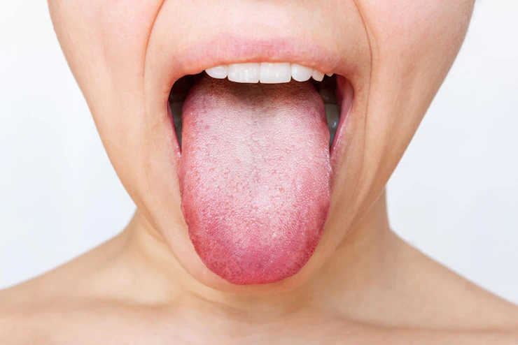 A girl is showing her tongue