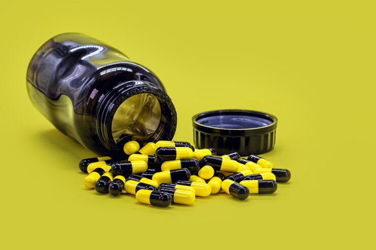 Black and yellow-pills out of the bottle