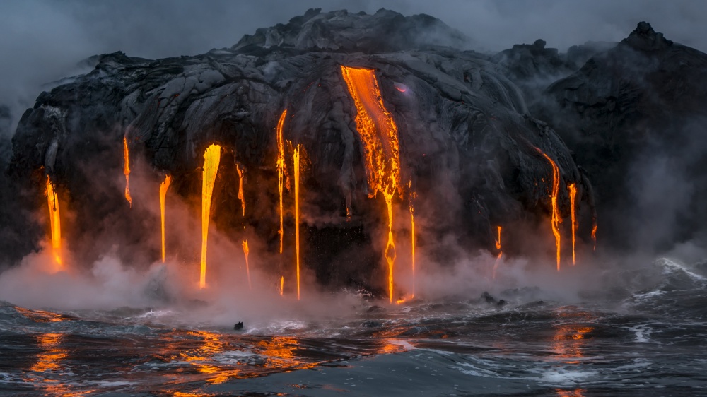 Molten magma dropping from a volcanic mountain