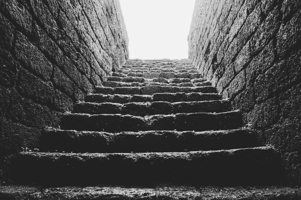 Low Angle Grayscale of Empty Brick Stairs
