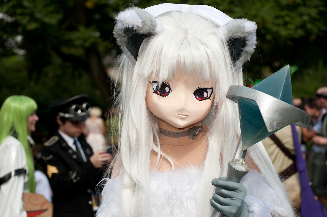 Anime Character With White Hair And Dress And Is Holding A Wand