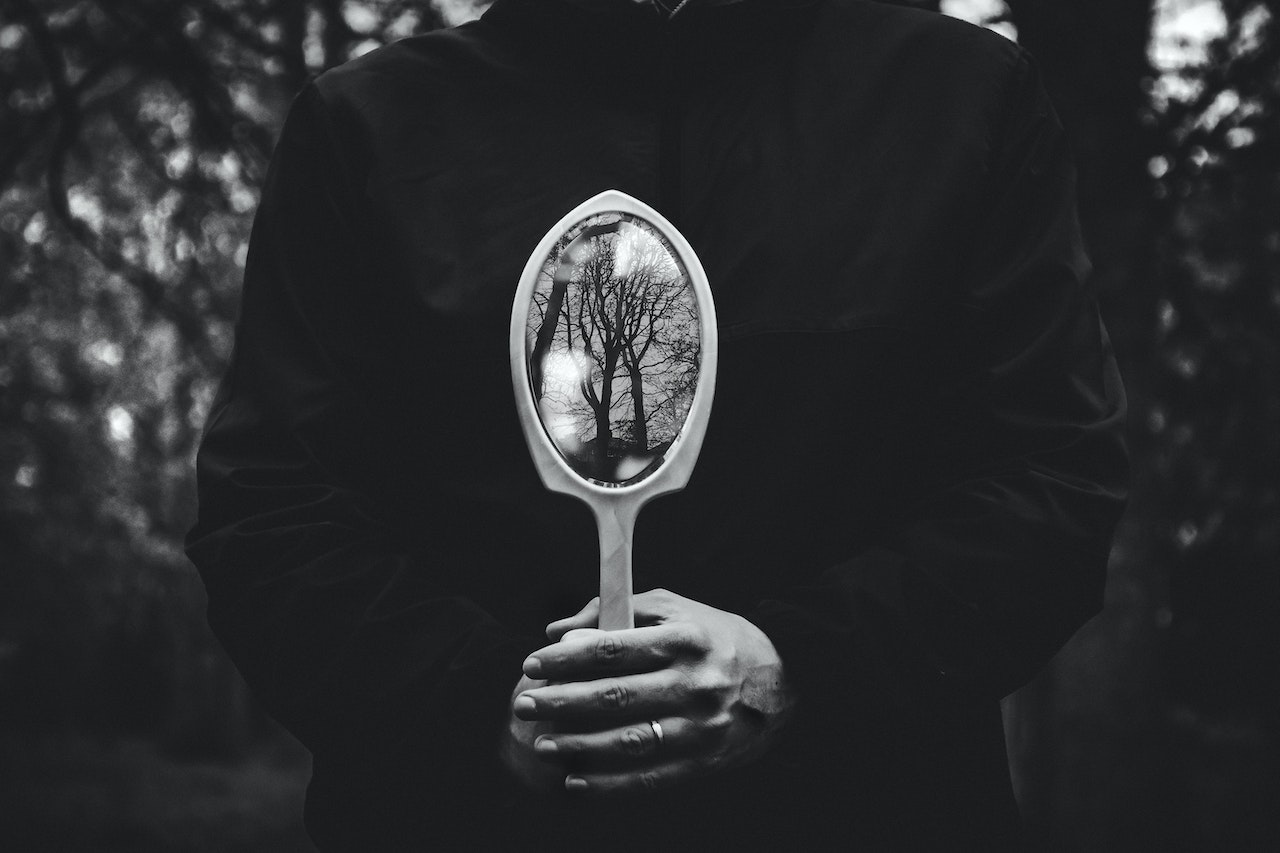 Person Holding A Hand Mirror