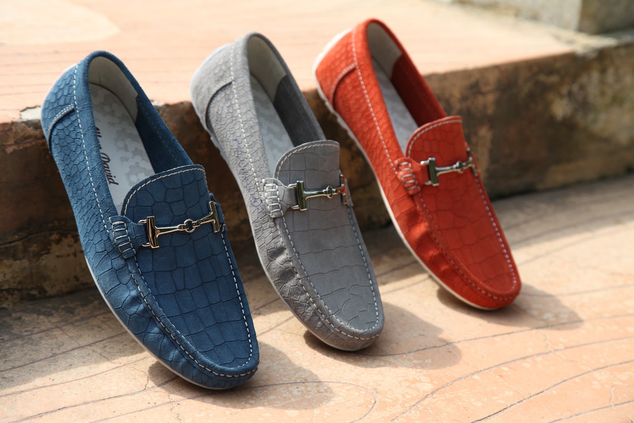 Three Unpaired Red, Gray, and Blue Horsebit Loafers