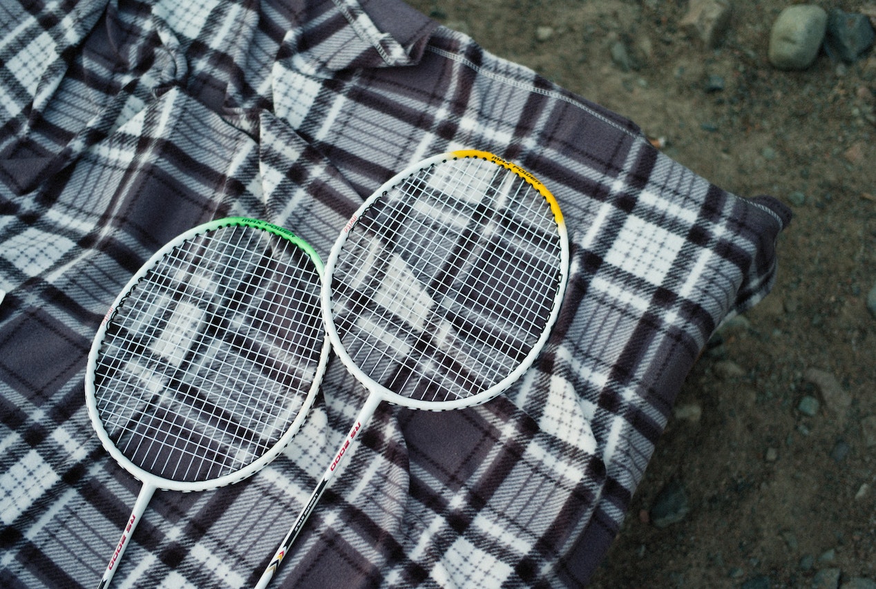 Badminton Rackets on Checkered Textile