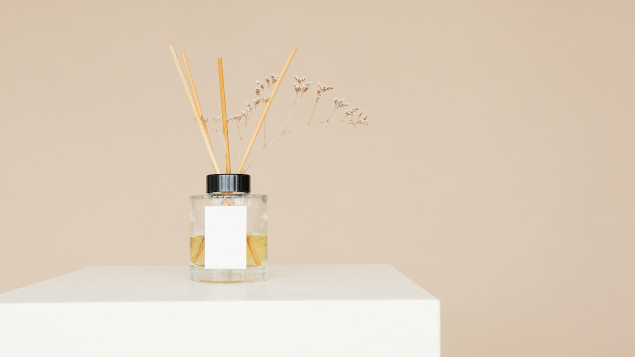 A Reed Diffuser on a White Surface