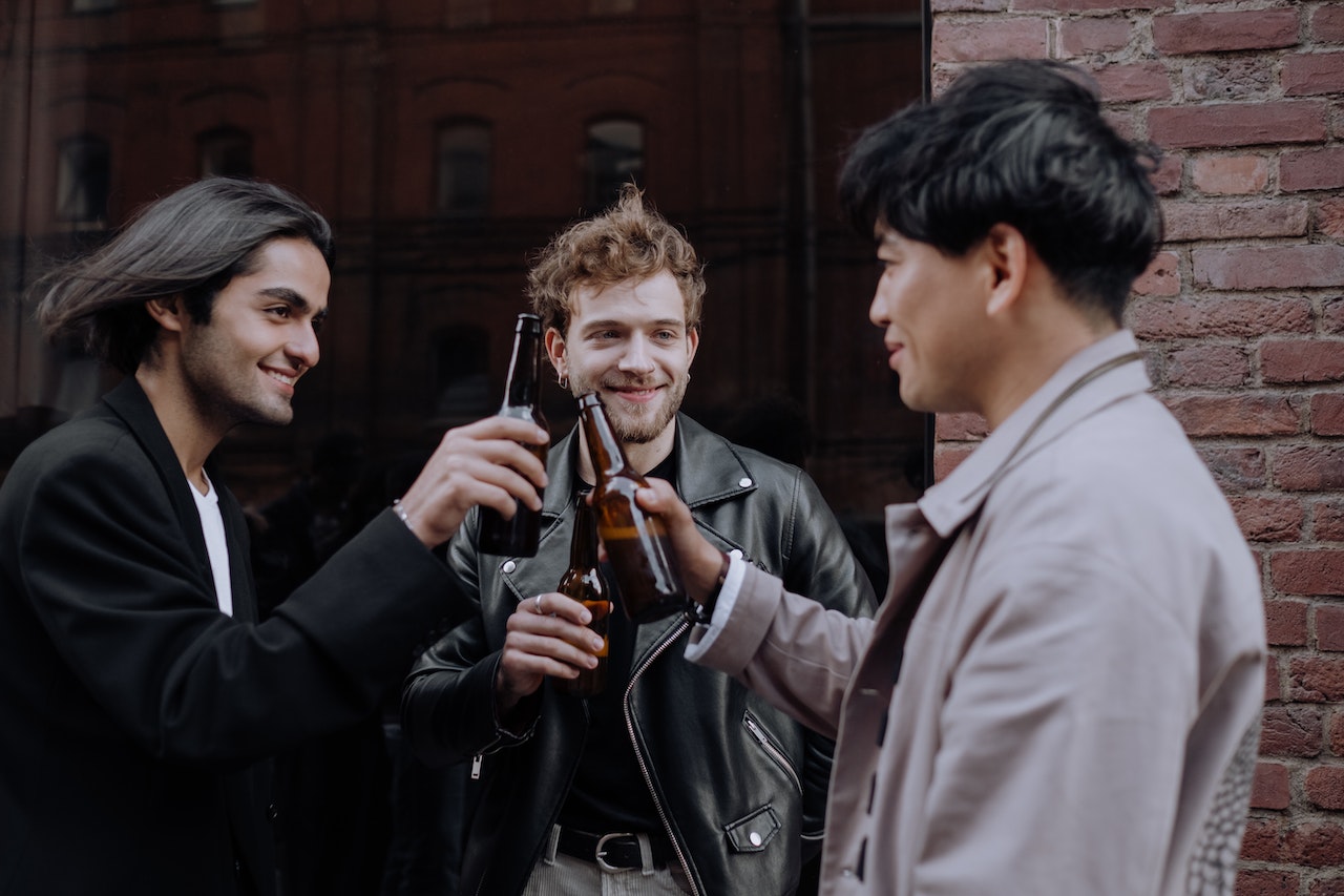 Men Drinking Beers in the Street
