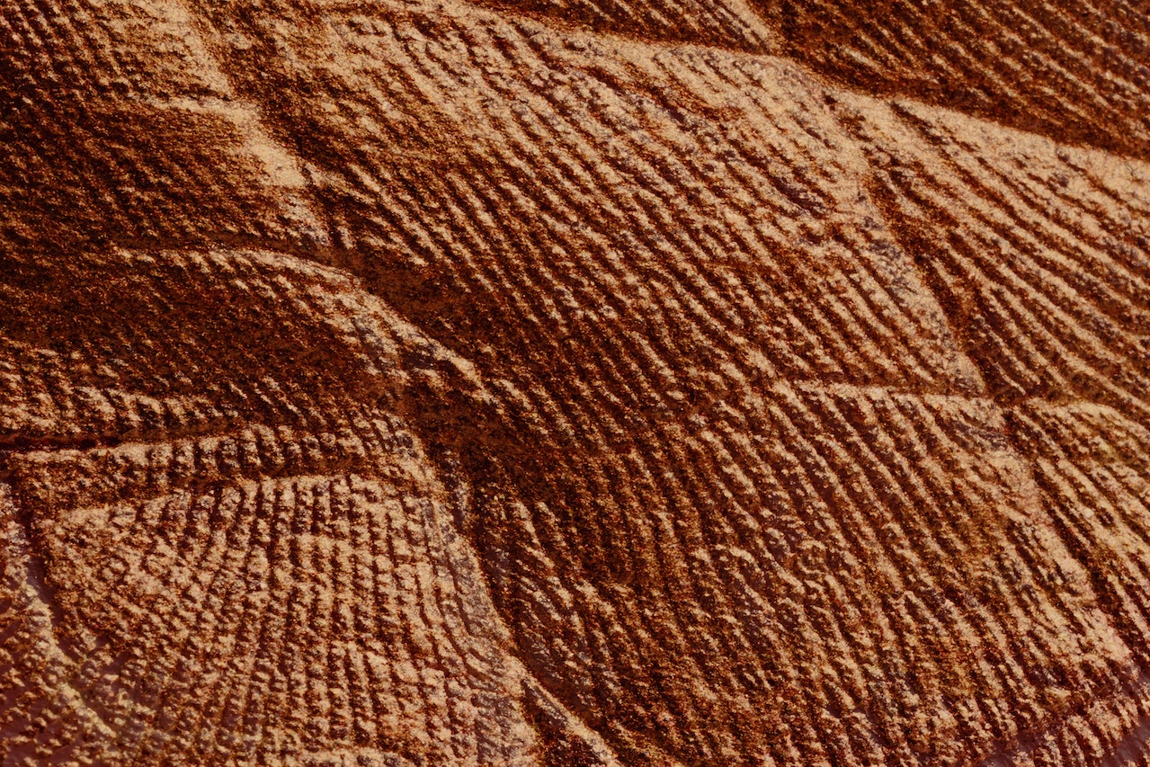 Textured parget surface of brown color