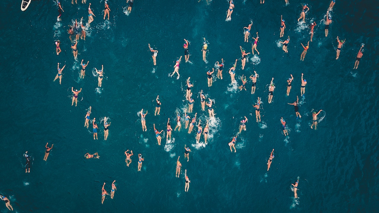 Aerial Shot Of People Swimming In The Sea