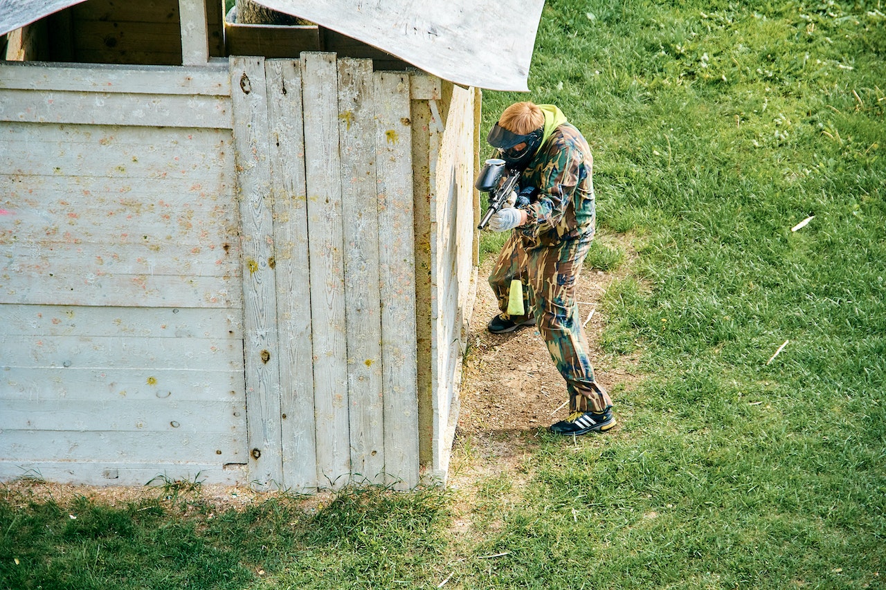 A Person Standing Behind a Shed