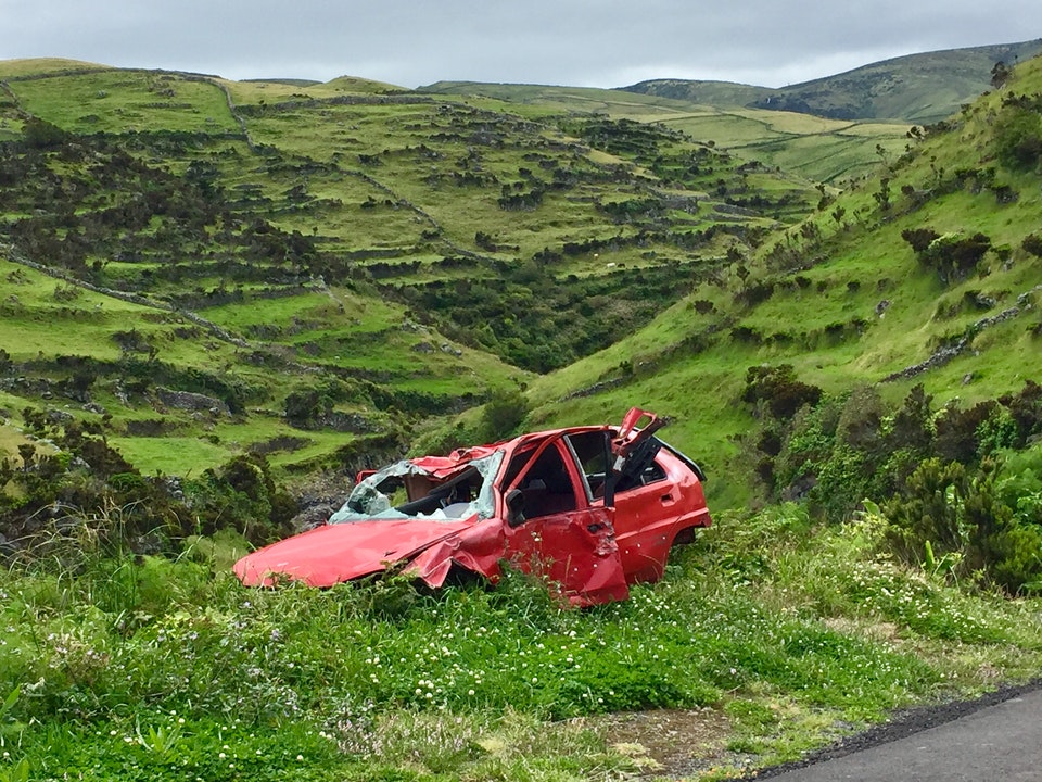 Broken Car Over A Cliff