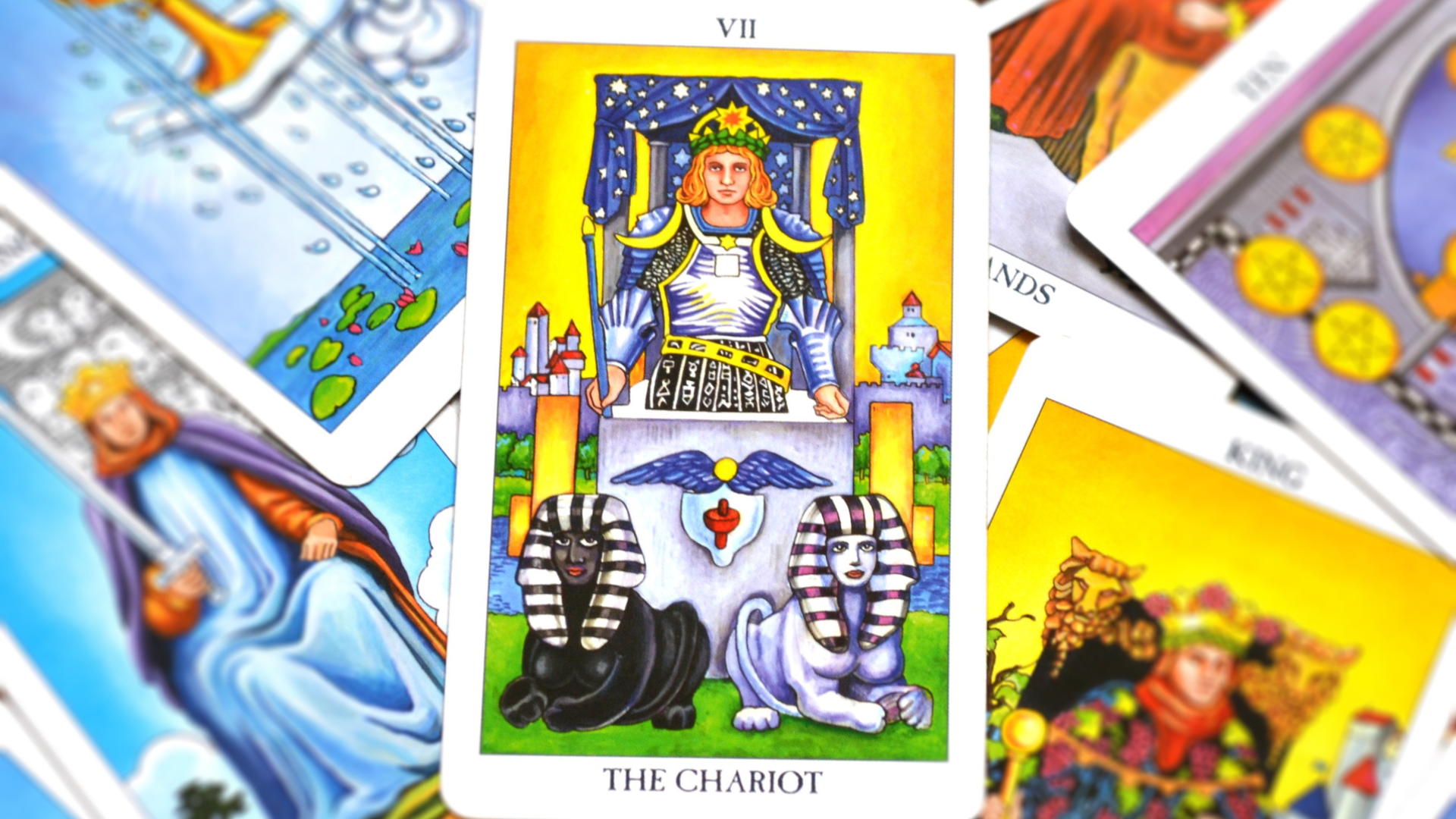 Different tarot cards with the Chariot Card placed in the middle