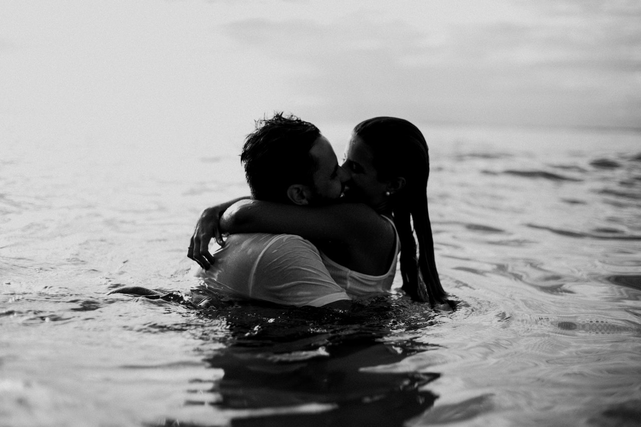 Man and Woman Kissing Together In The Ocean