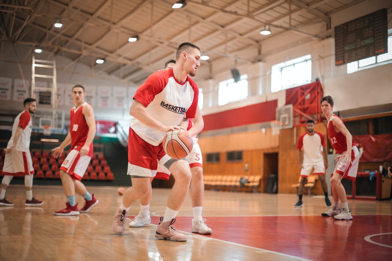 Men Playing Basketball Inside Gym