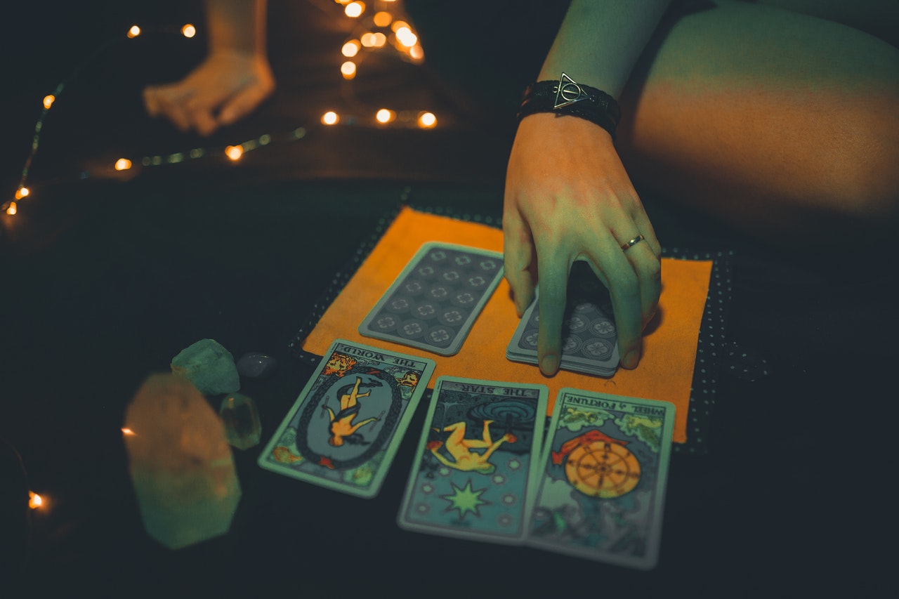 Future Teller With Tarot Cards on Table