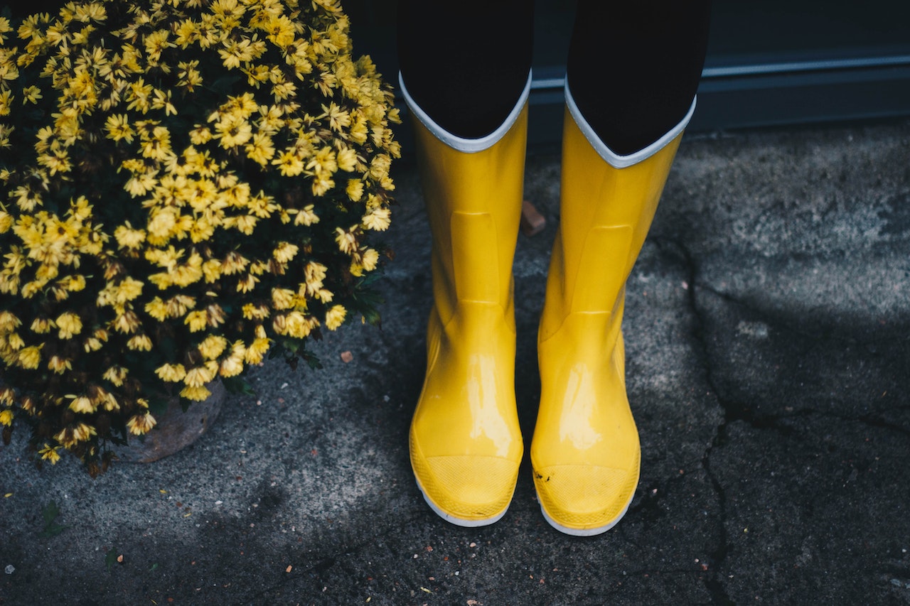 Yellow Boots Near Flowers