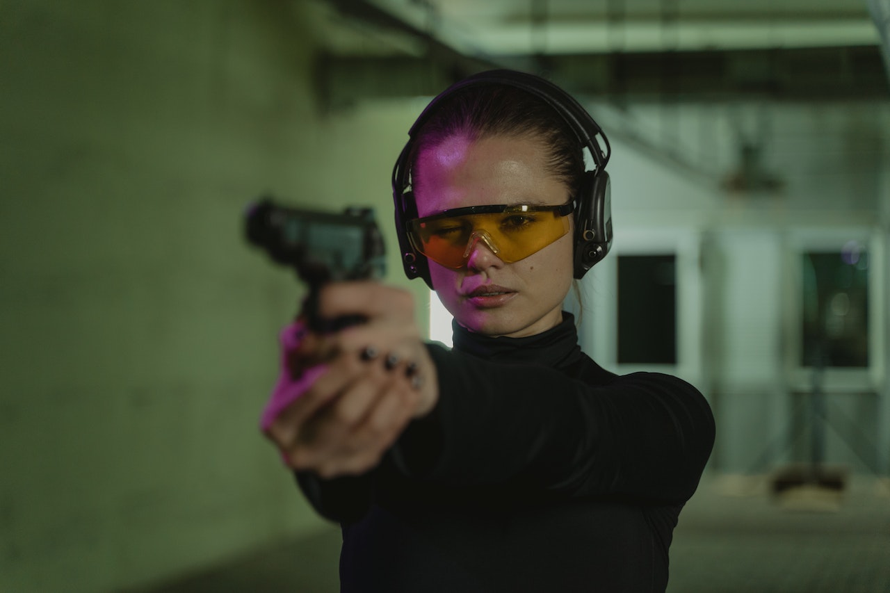 A Woman Holding a Gun