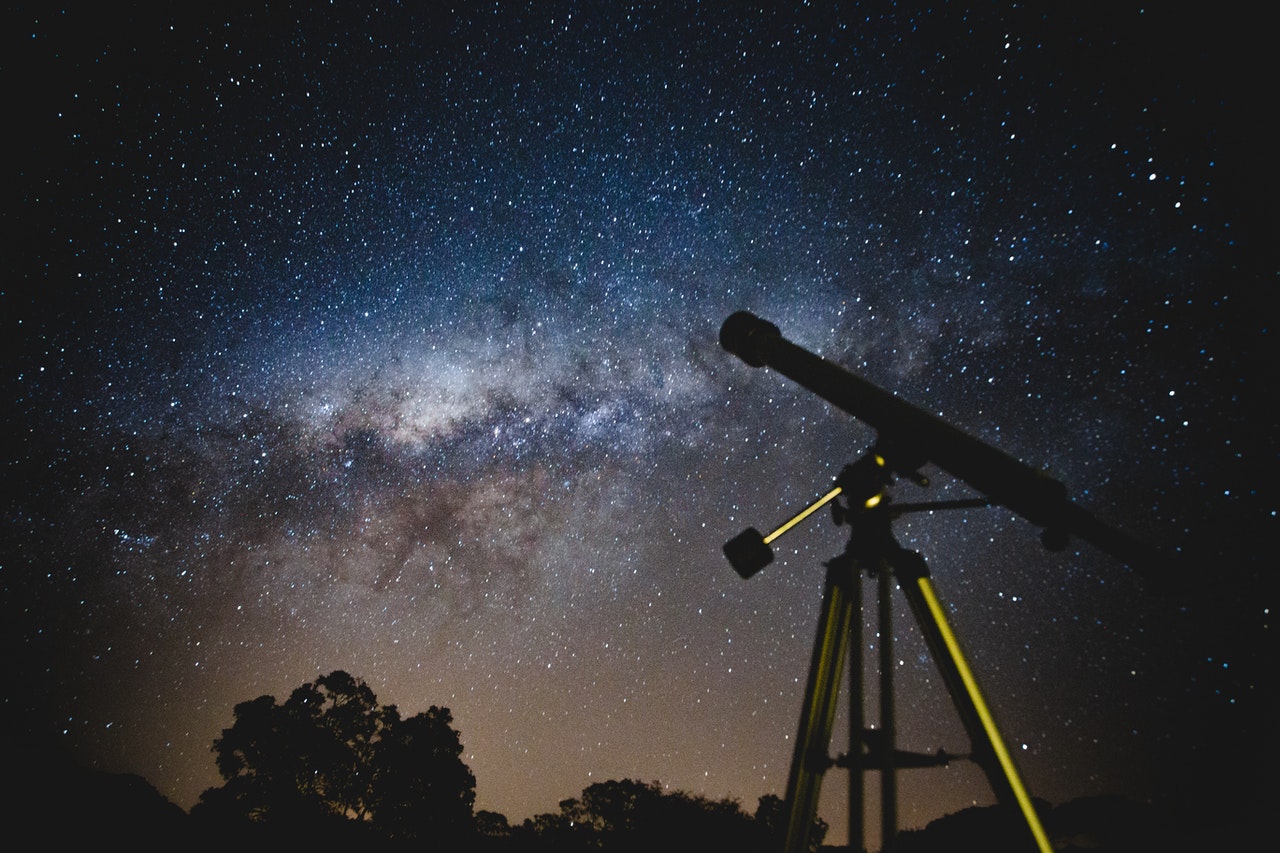 Black Telescope Under A Starry Night Sky