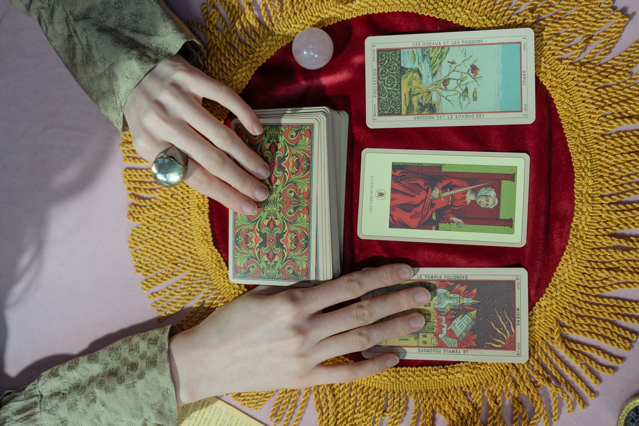 Close-Up Shot of a Person Holding Tarot Cards
