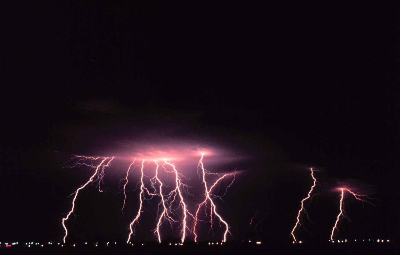 Lightning Striking Over The City During Nighttime