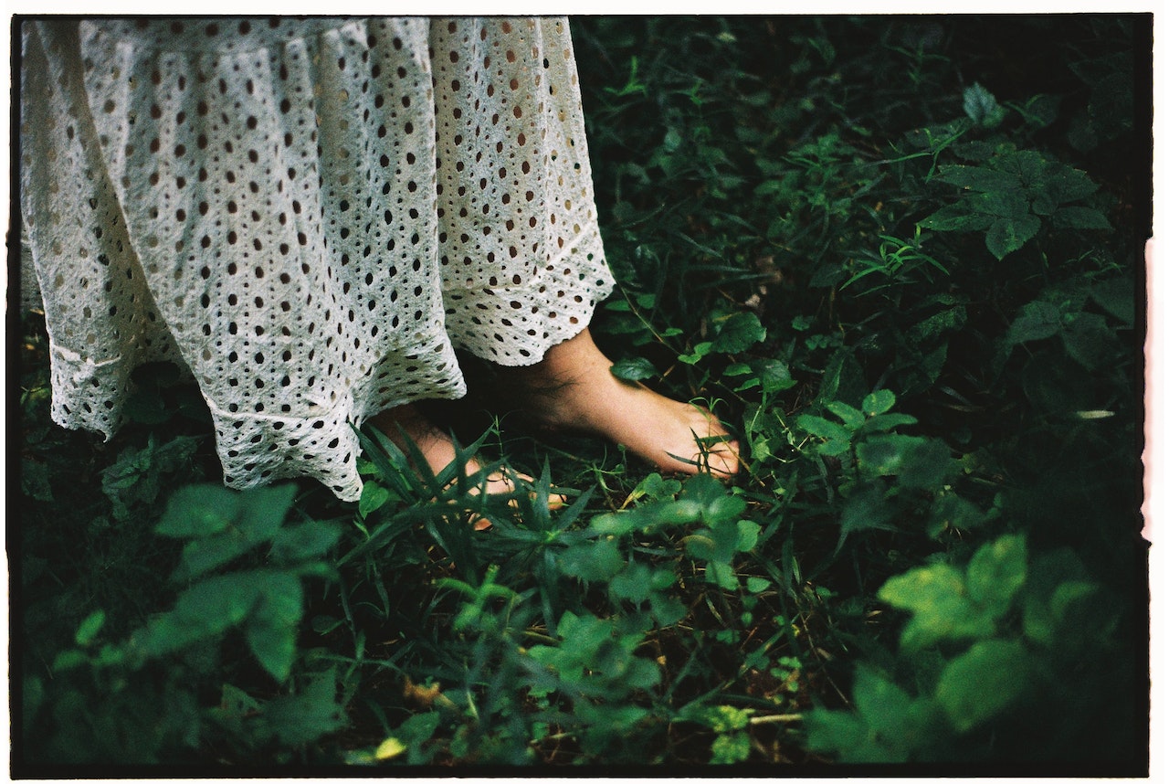 Woman Standing Barefoot