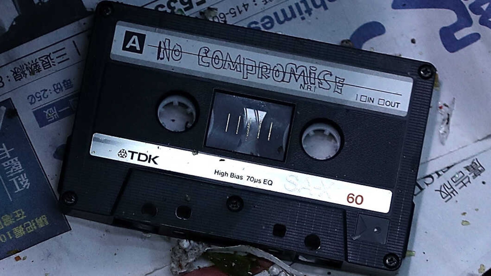 An Old Black Cassette Tape With A Note That Said 'No Compromise'