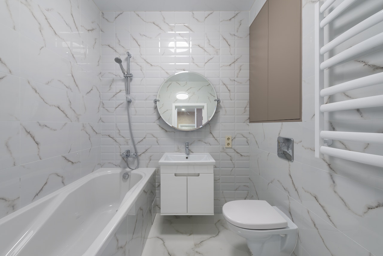 Interior Design of a Bathroom With Bathtub, Toilet, Washbasin and Mirror