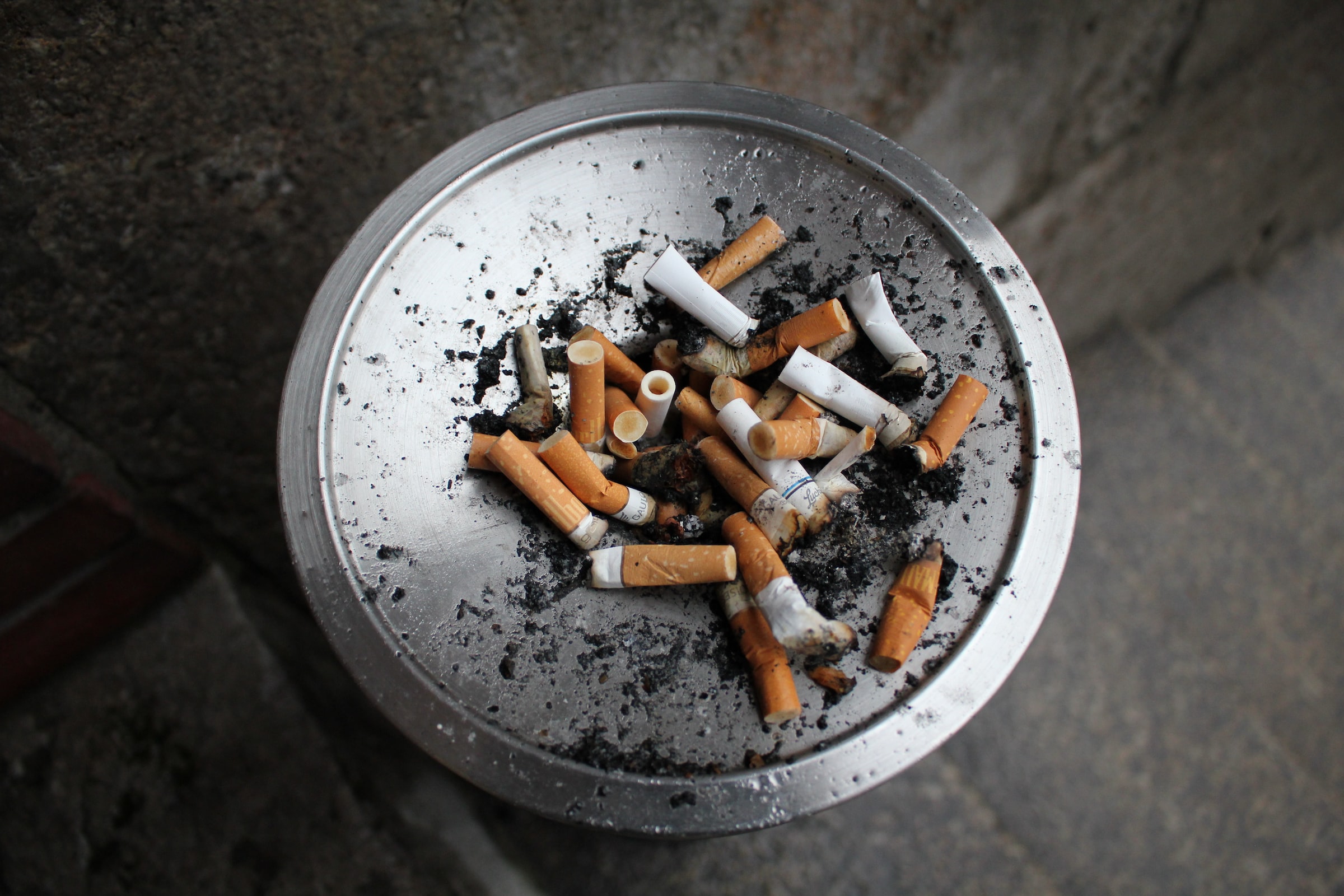 Bowl full of used cigarettes