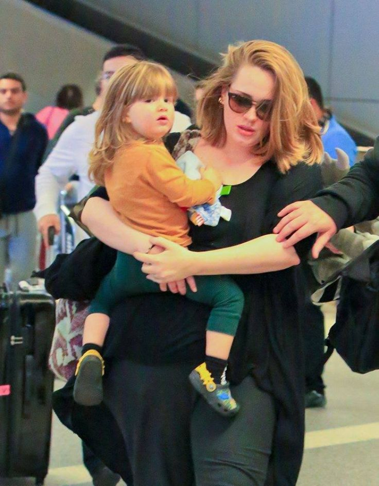 Adele carrying her son Angelo Adkins while coming out of the airport