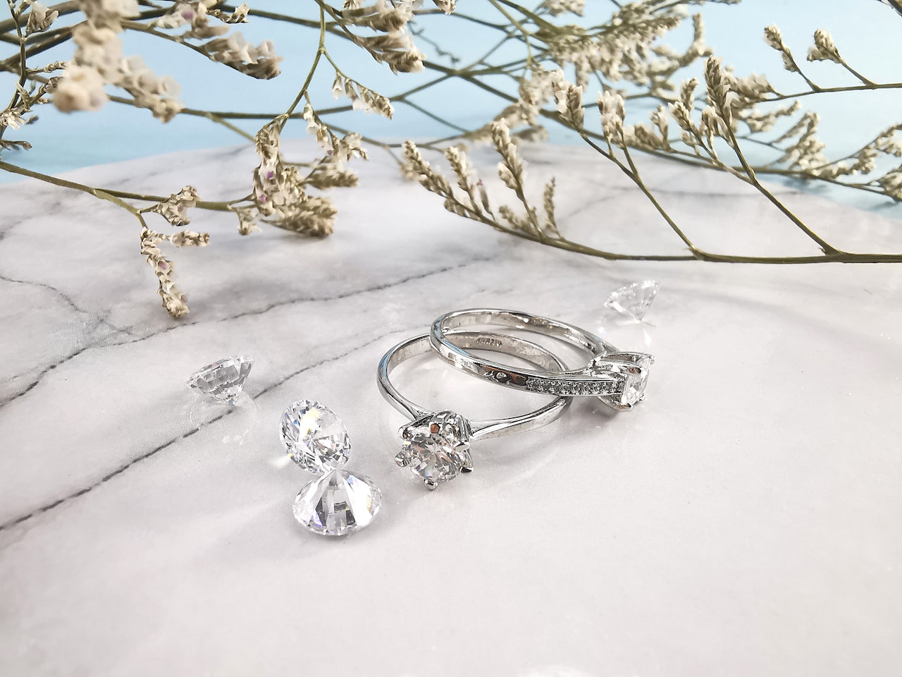 Rings and diamonds near the plant twigs