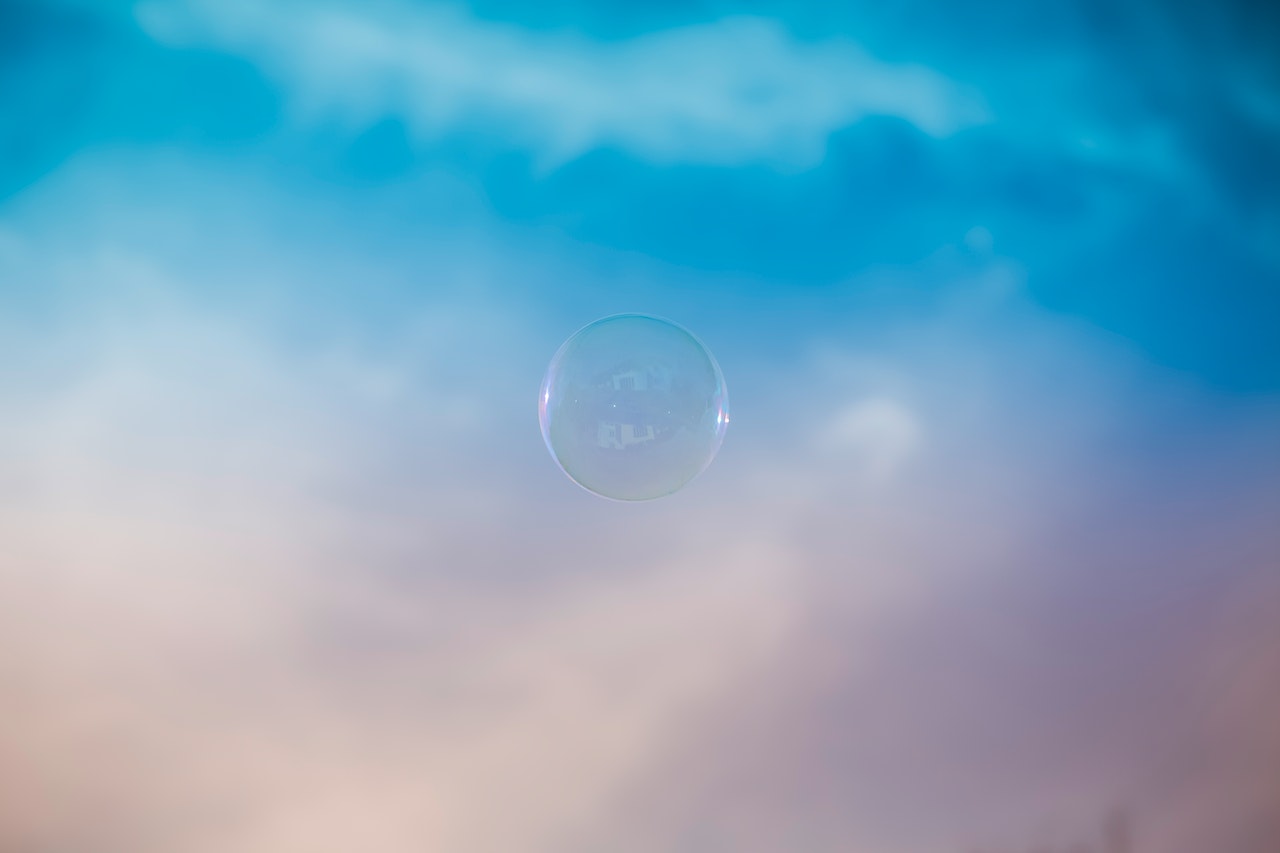 A Bubble Floating In The Blue Sky