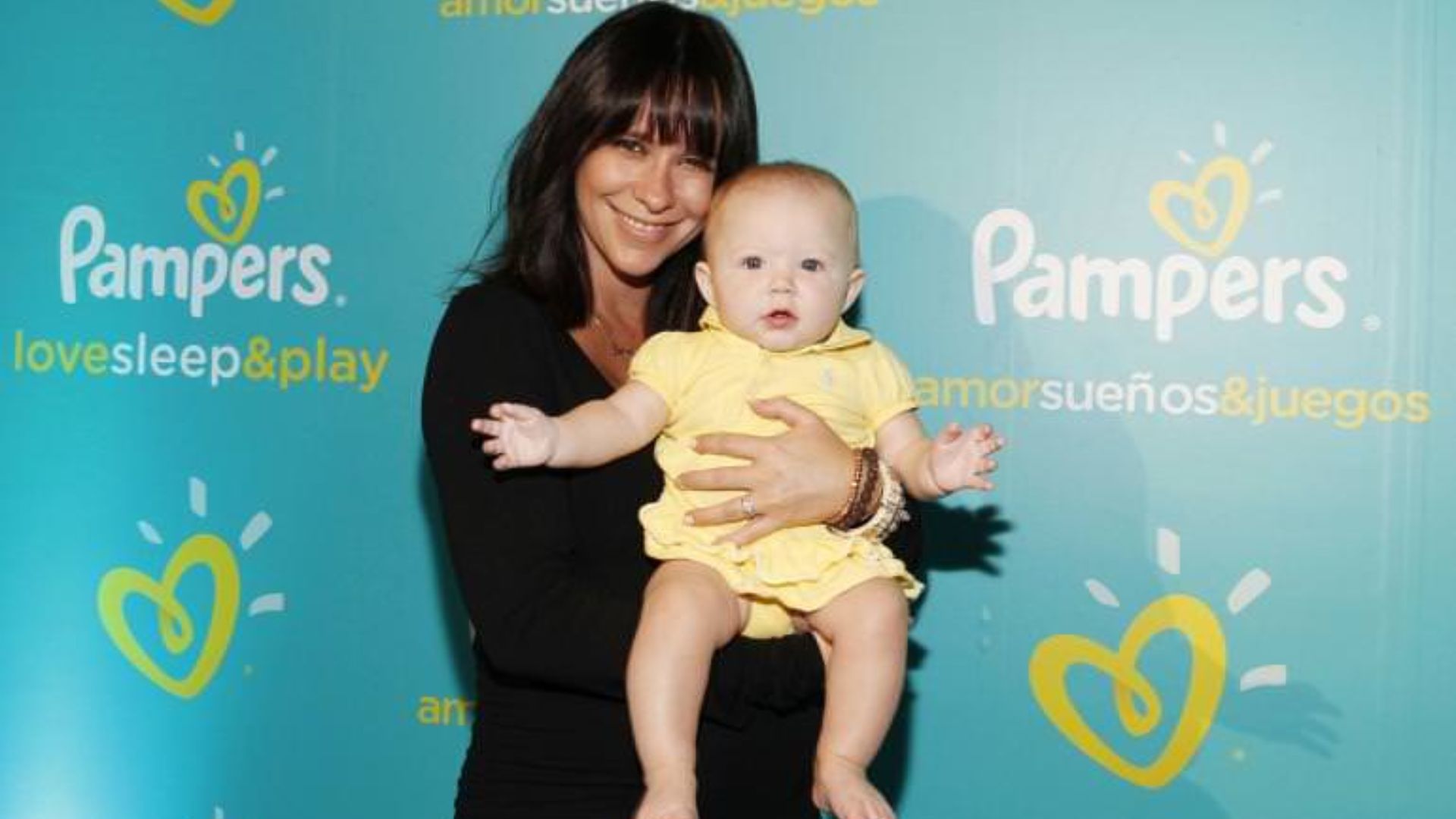 Autumn James Hallisay In Her Mother's Hands At Pampers Event