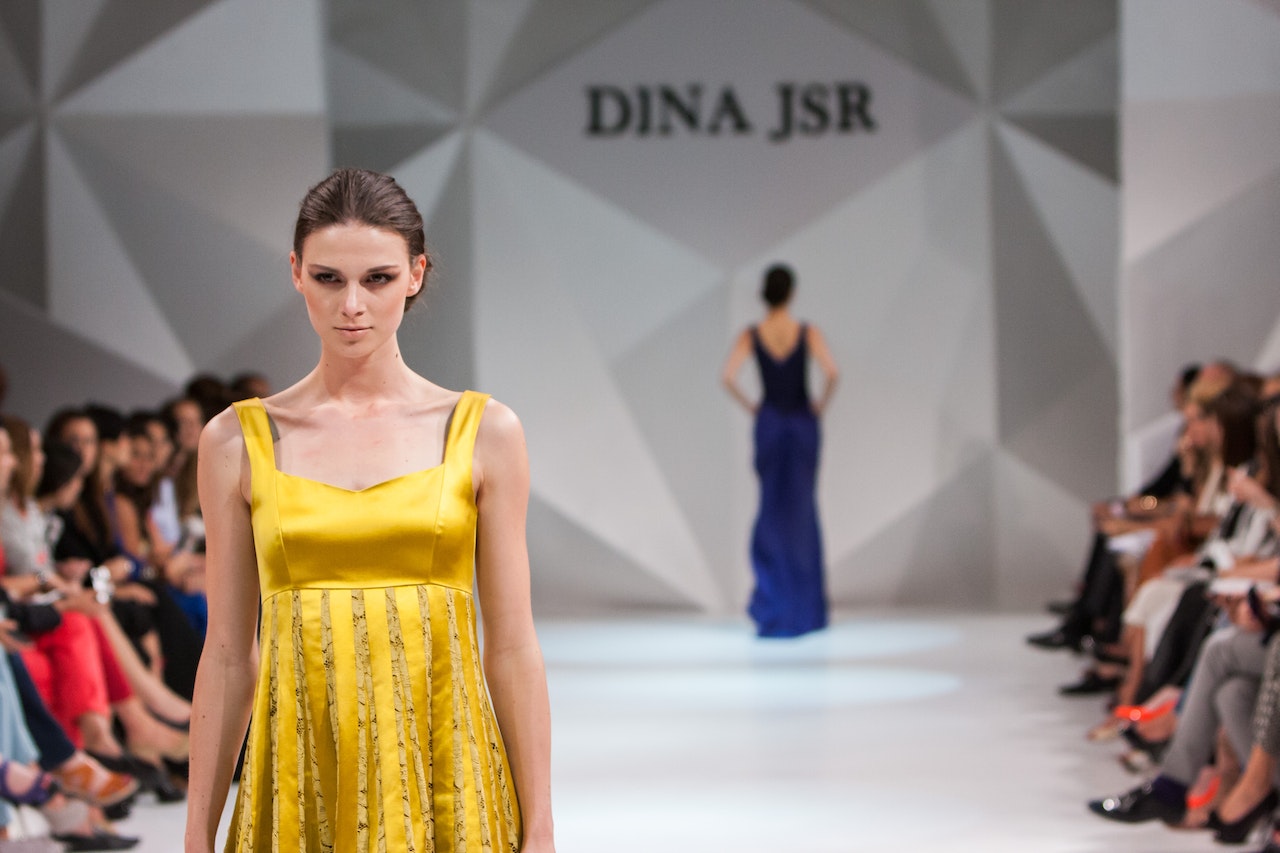Women Walking on Catwalk At The Dina JSR Fashion Show