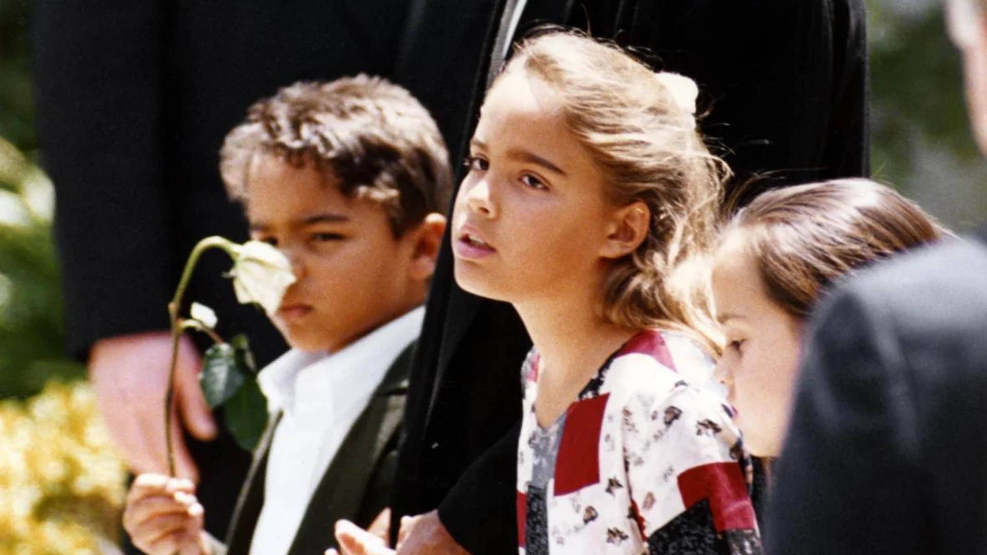 Sydney Simpson along with her father and brother during her mother's funeral