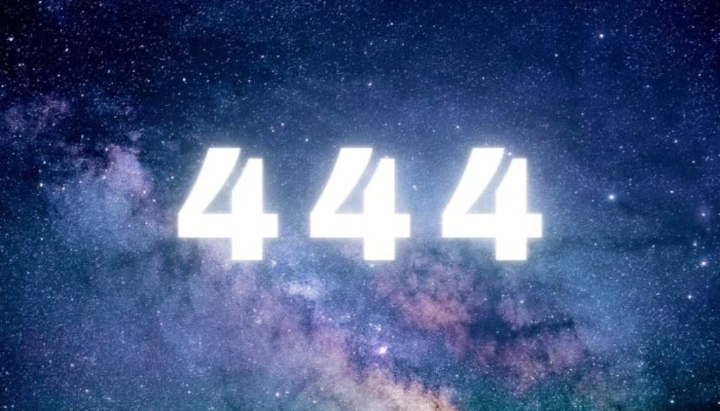 The numbers 444 in white with the milky way in the background