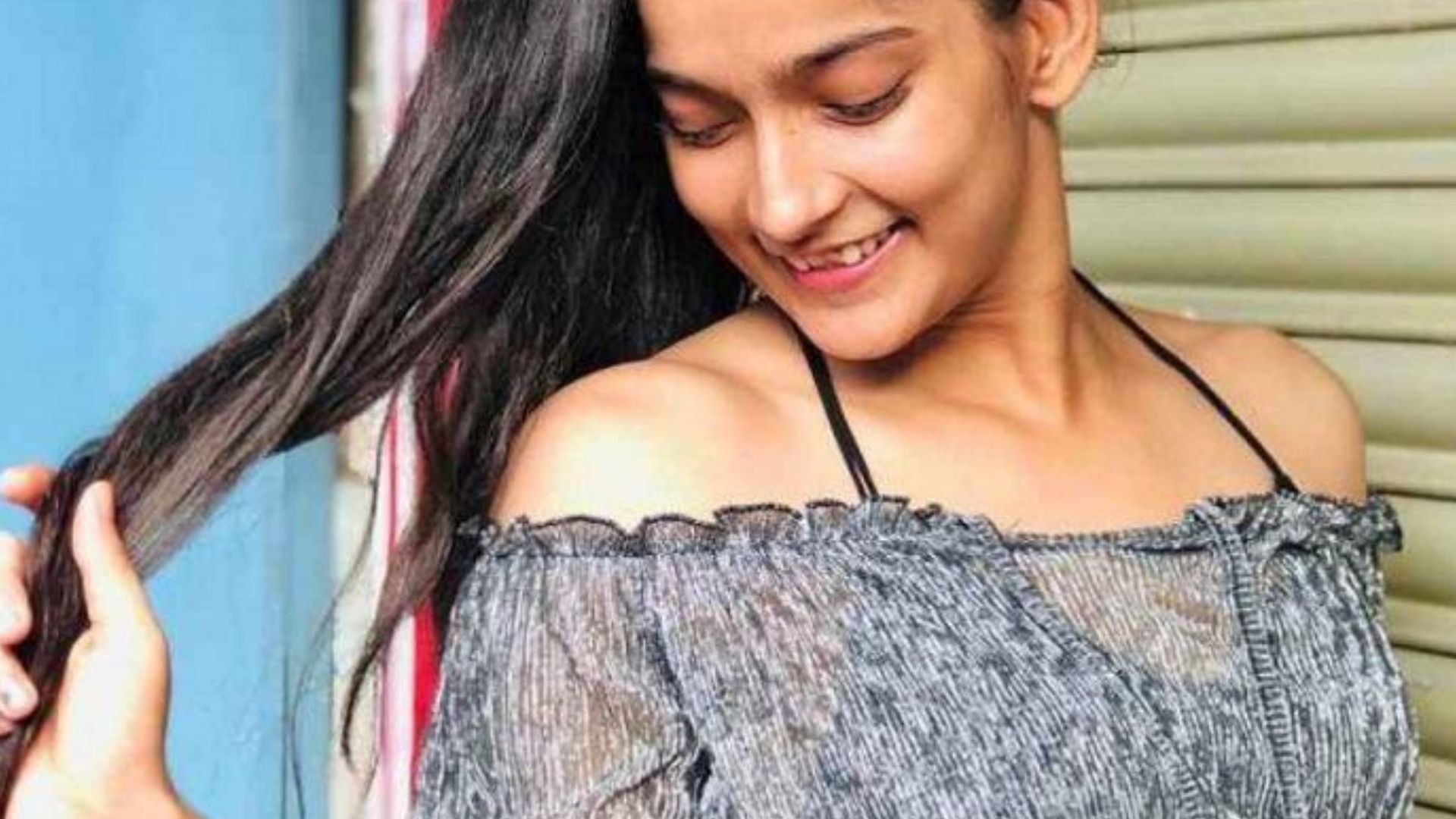 Vartika Jha Smiling And Holding Hair on Her Hand
