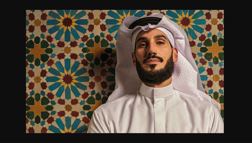 Hassan Jameel wearing a jalamia and a head scarf