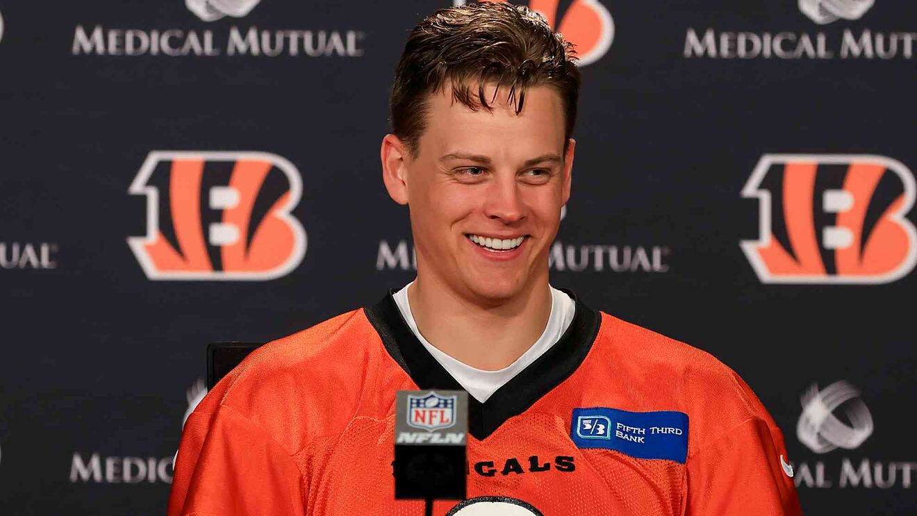 Joe Burrow wearing the orange uniform of his team as he smile during an interview