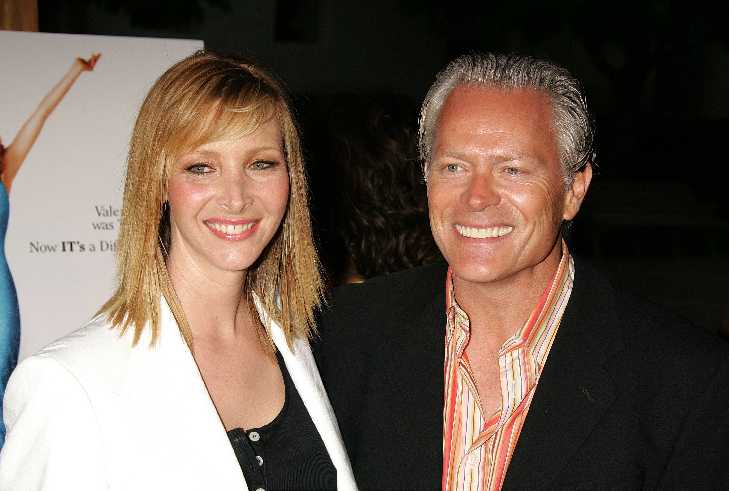 Michel Stern with his wife Lisa Kudrow at an event with smiles on their faces