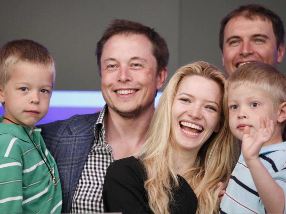 Elon Musk and Justine Musk with their twins laughing