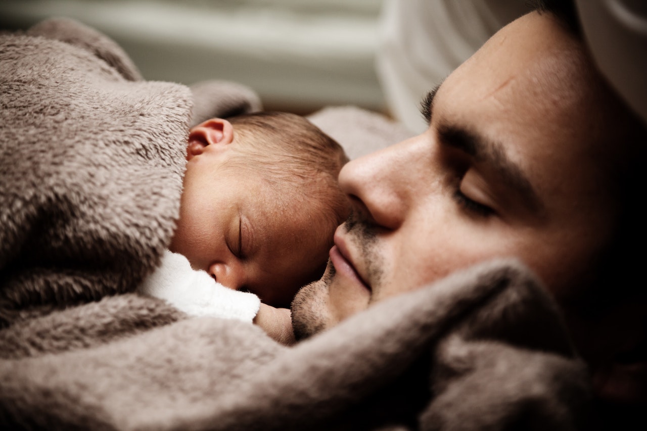 Sleeping Man and Baby in Close-up
