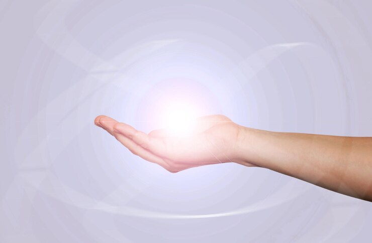 Closeup of hand of a young-woman holding light ball