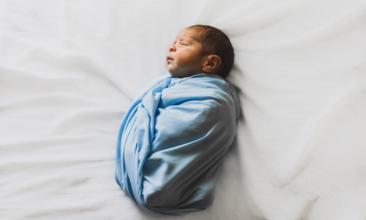 New Born Baby Covered With Blue Blanket