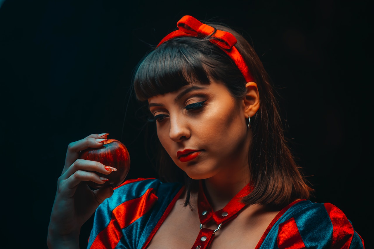 Woman Holding Red Apple