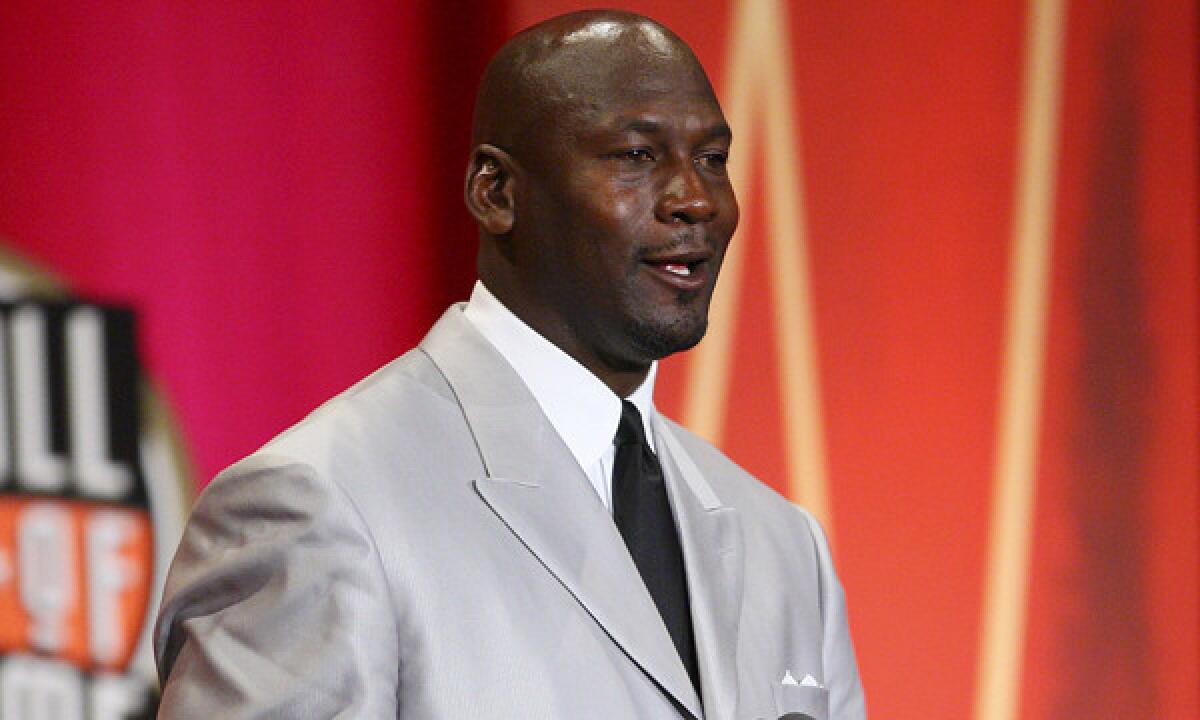 Michael Jordan wearing a gray coat