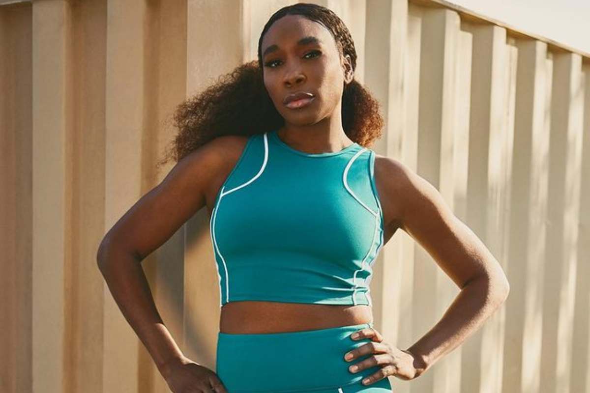 Venus Williams wearing a blue green sports outfit