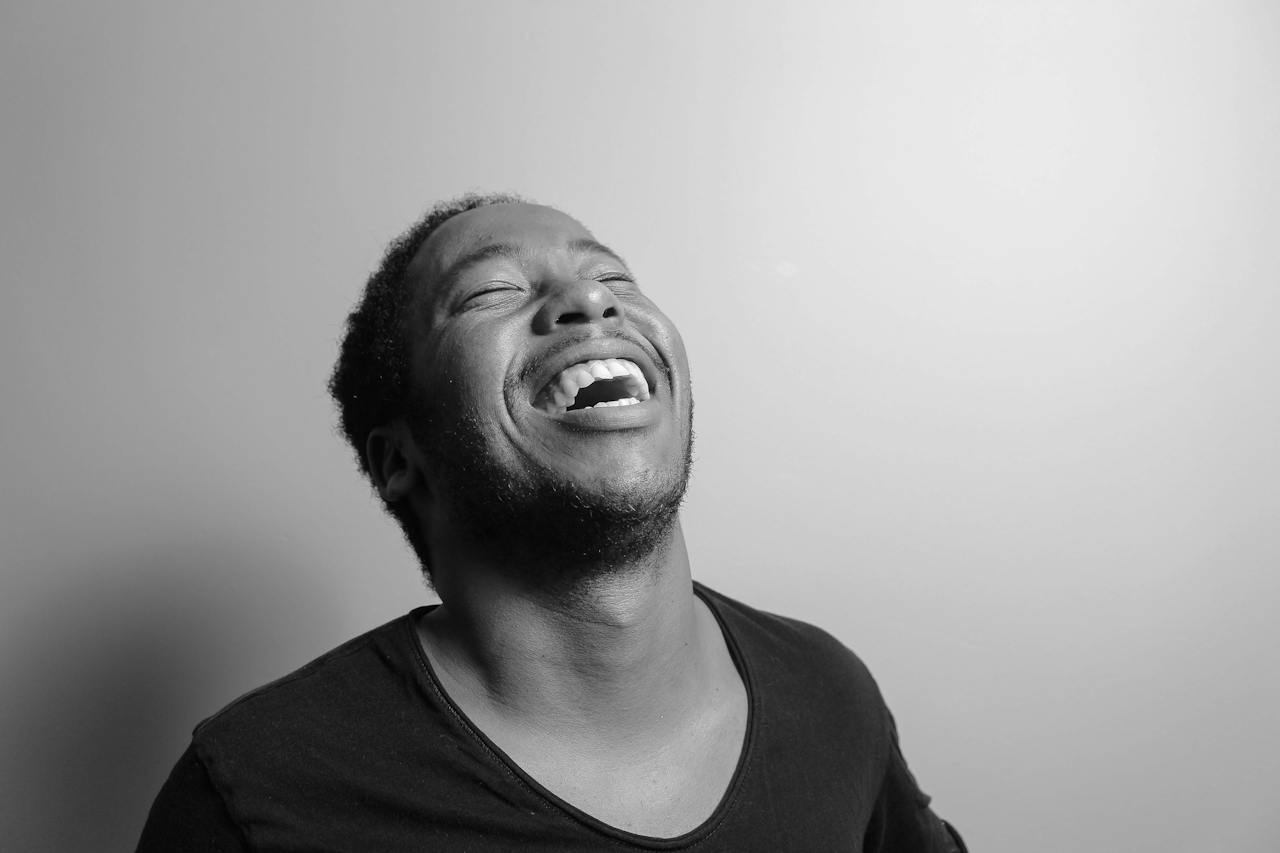 Grayscale of Man Laughing