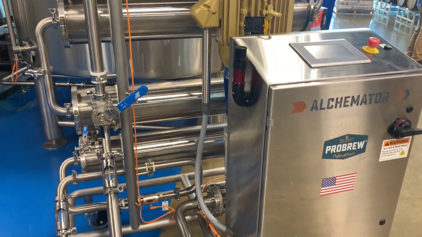 The stainless steel rectangular ProBrew Alchemator connected to several long steel tubes
