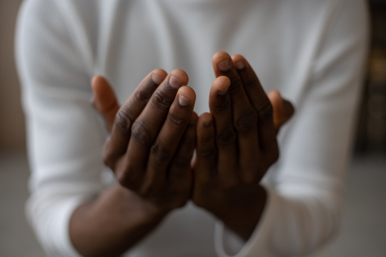 Black man praying 