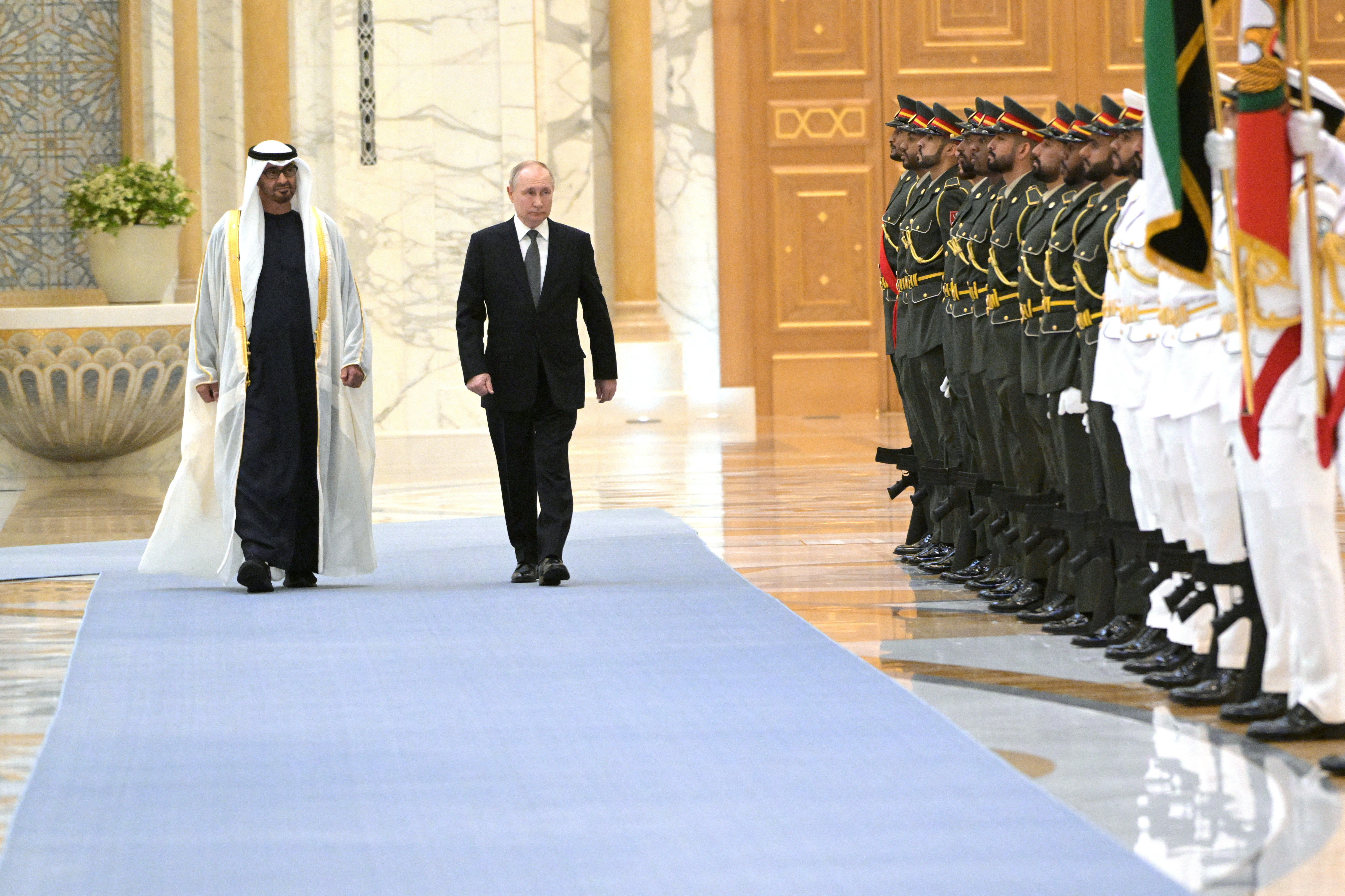 President of the United Arab Emirates Sheikh Mohamed bin Zayed Al Nahyan and Russian President Vladimir Putin walk during a meeting at Qasr Al Watan in Abu Dhabi, United Arab Emirates December 6, 2023.