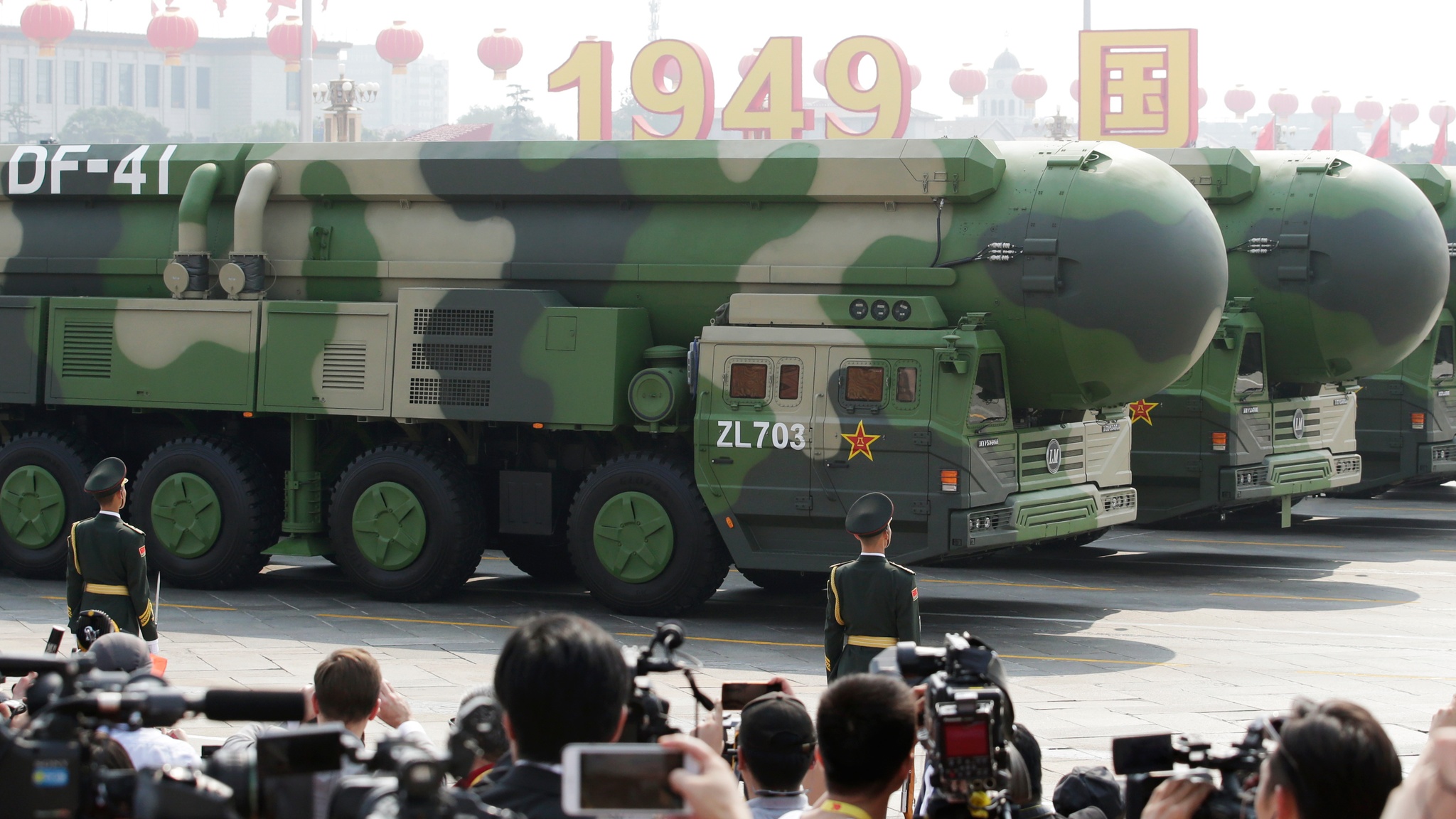 People taking pictures of Chinese missiles